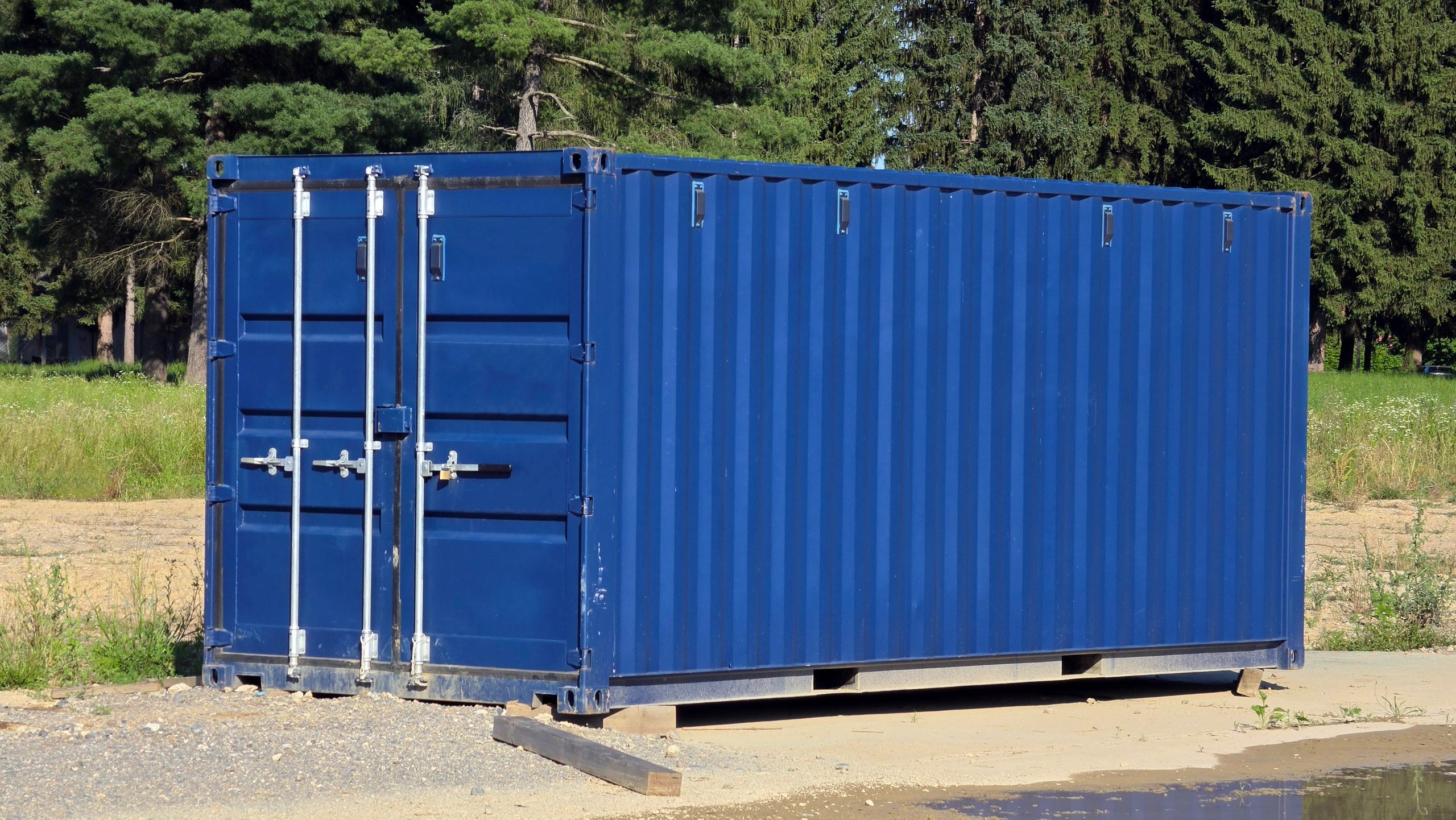 Roll-off container placed on a gravel lot